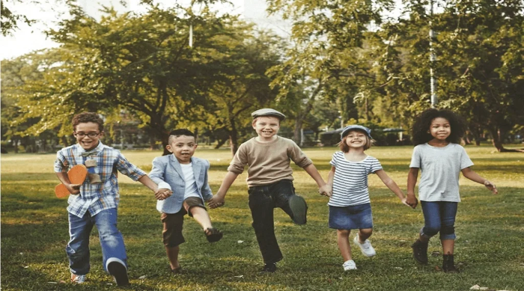 Social skills children build by adjusting behavior in shared group activities