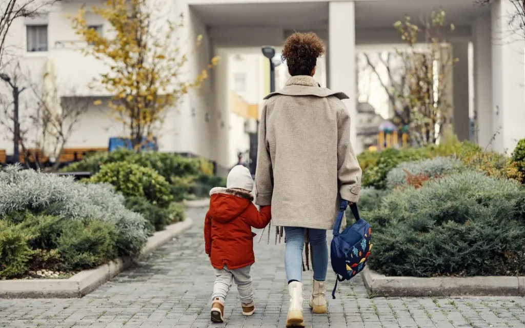 Child practicing school readiness skills during a calm school drop-off
