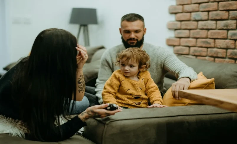 Parent explaining family rules to a child during a calm home conversation
