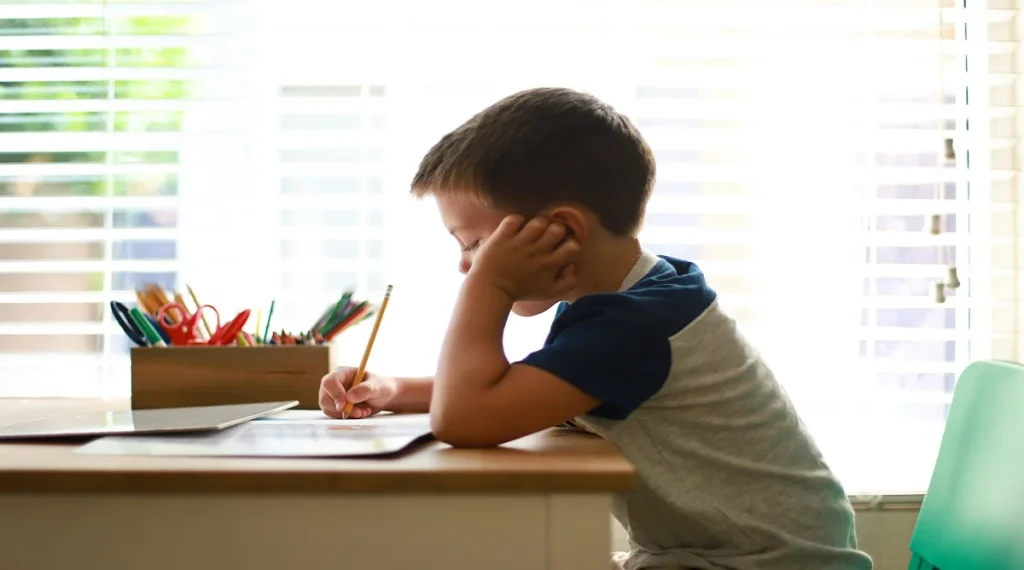 Child practicing self-management skills by retrying after a mistake