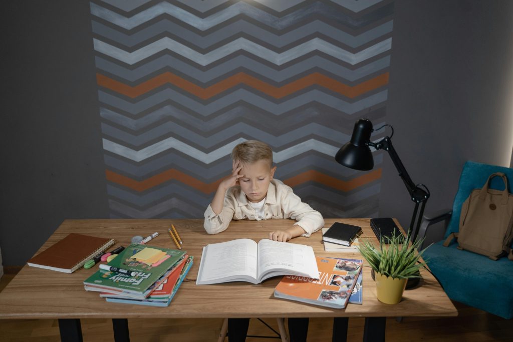 Child using an organized space to reduce homework resistance and improve homework habits