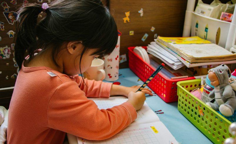 Child practicing school readiness skills before starting school