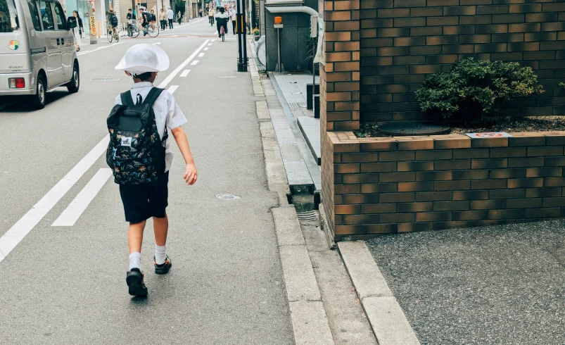 Child learning to pack school bags more independently at home