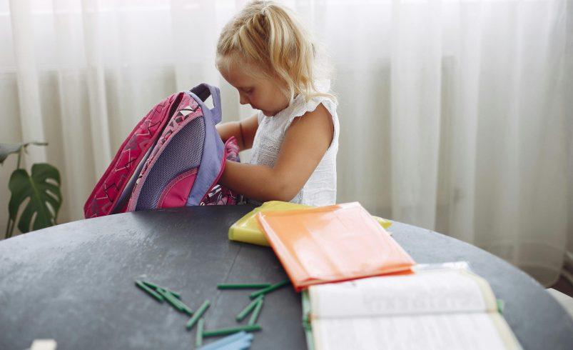 Child practicing school readiness skills before starting school