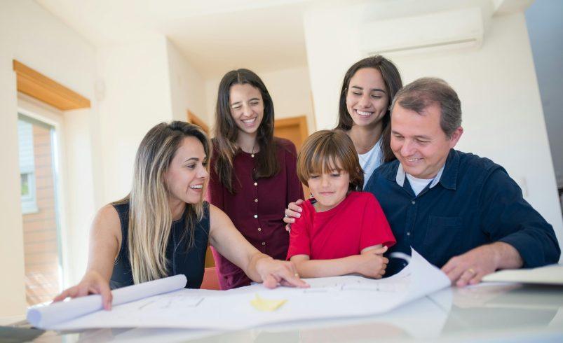 Family routine planning session at home with parents and children