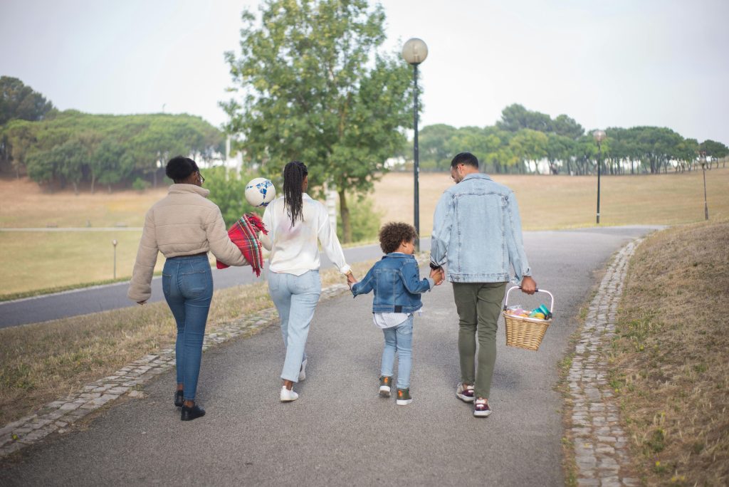 Family enjoying outdoor family activities during a nature scavenger hunt