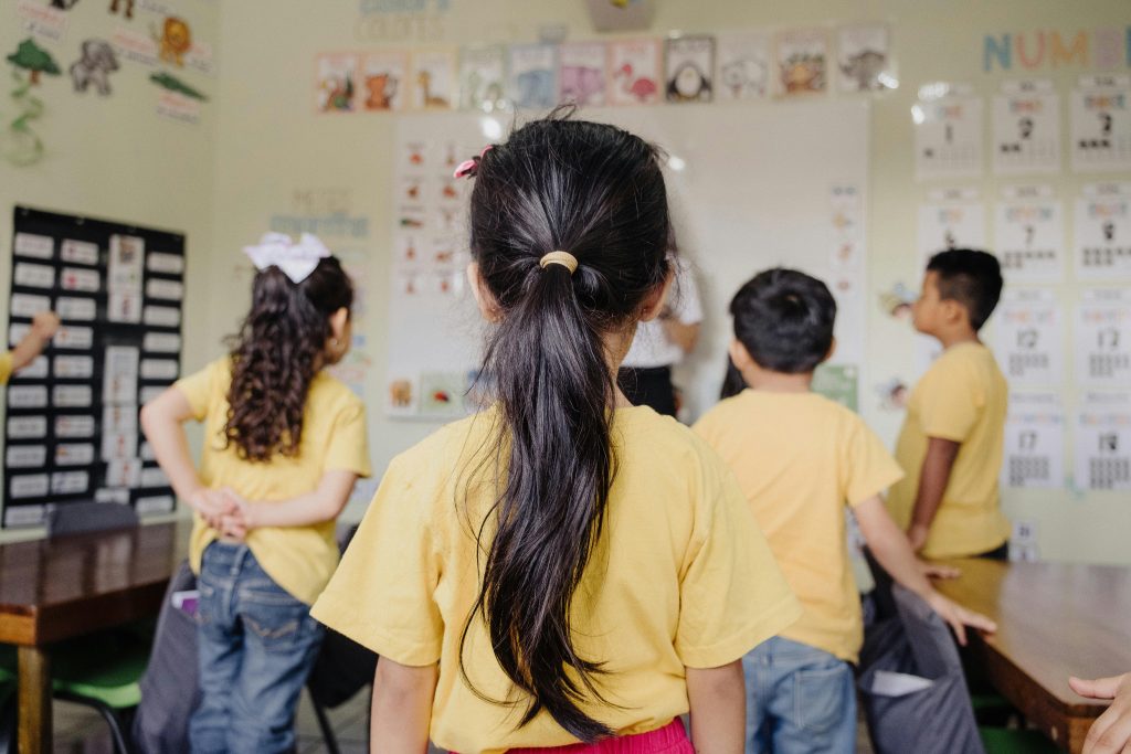 Children practicing school readiness skills in classroom routines