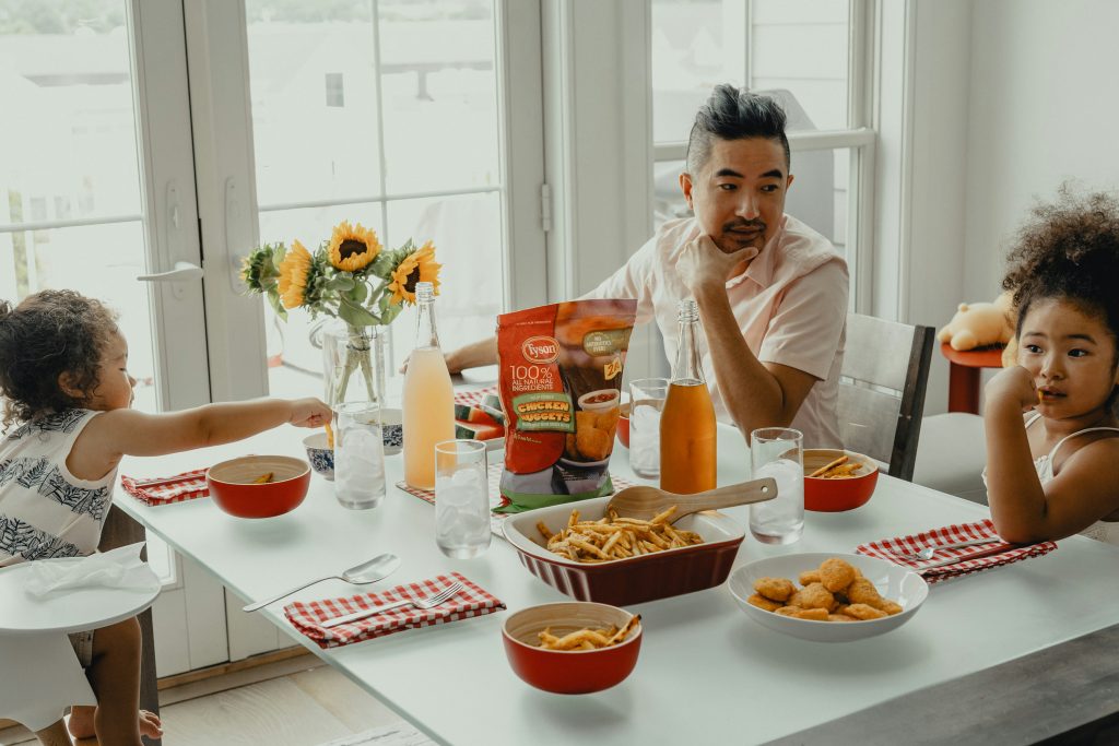Family breakfast helping avoid morning routine mistakes during busy weekdays