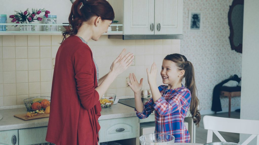 Parent building emotional safety while talking to children after a hard day later in the evening