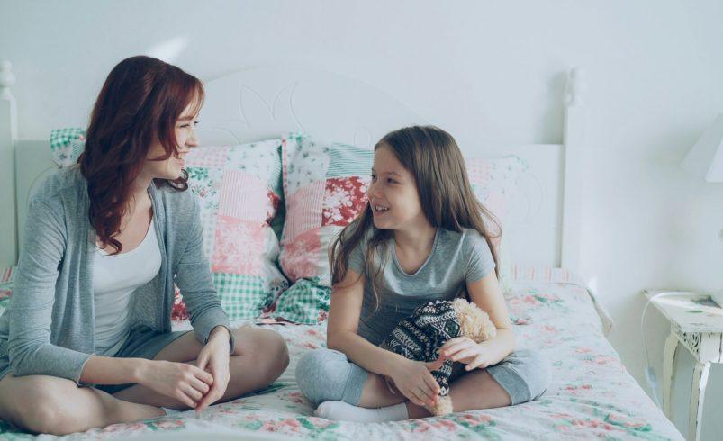Parent and child during the tween years having a calm conversation at home