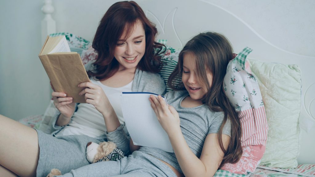 Parent and child reviewing school morning checklists for a calmer morning routine