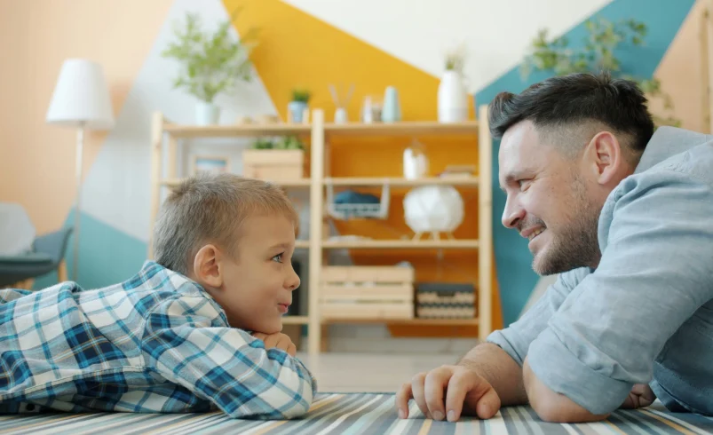 Parent and child during the early elementary years talking at home