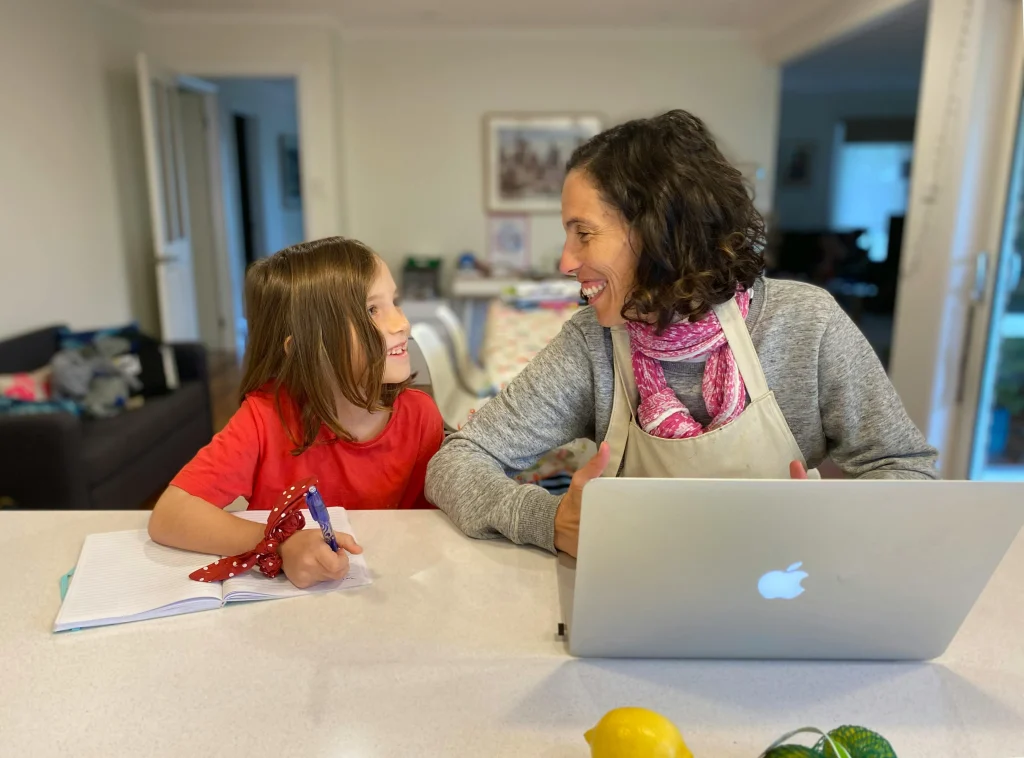 Parent and child using a checklist to stop children forgetting school items