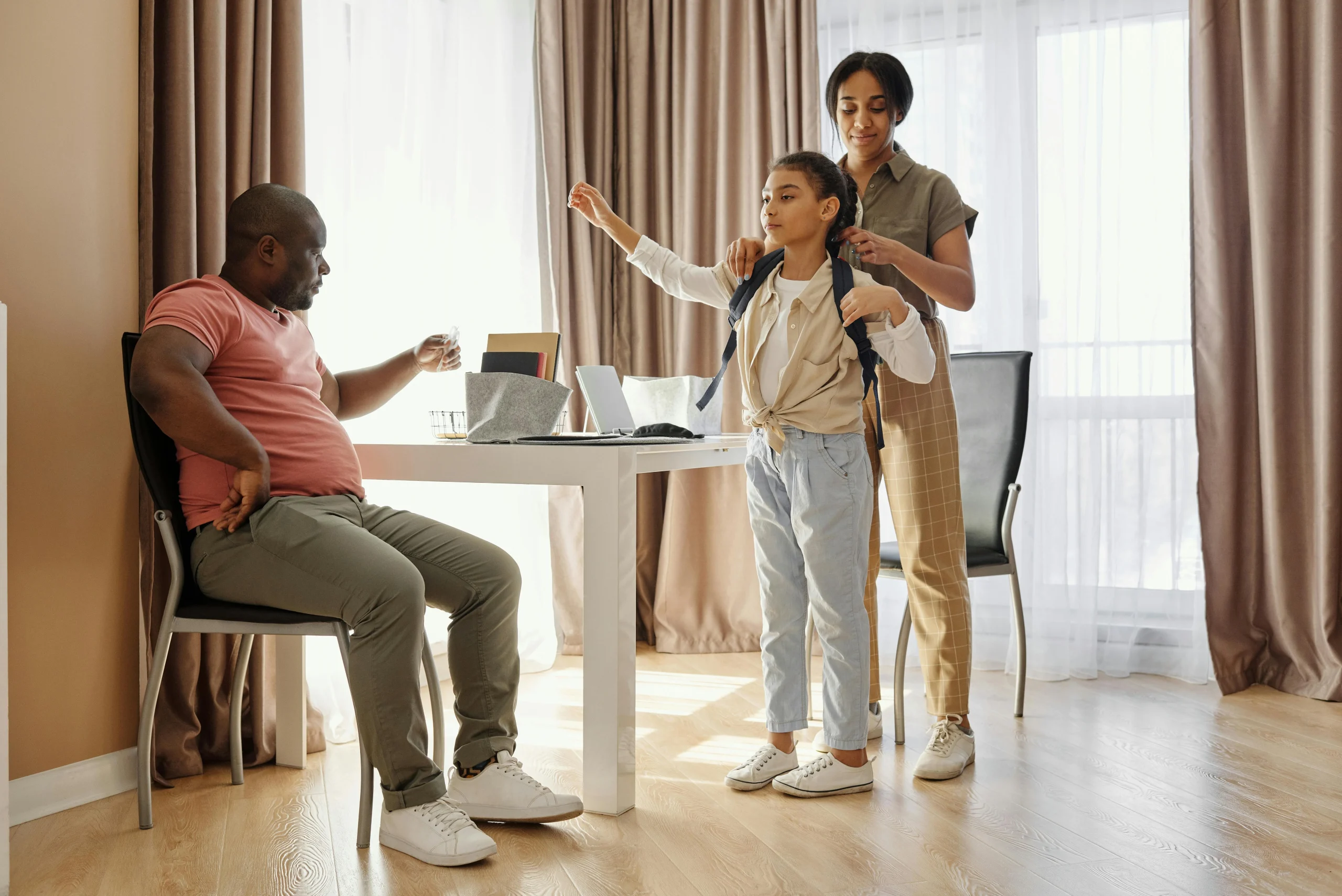 Parent helping when children forget school items during the morning routine