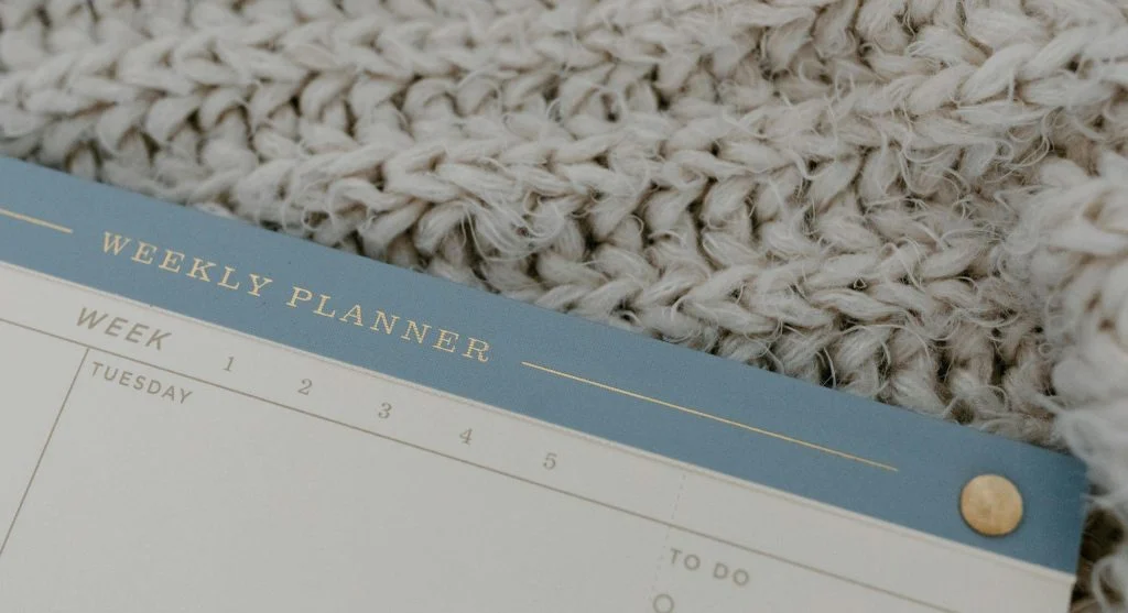Weekly family reset routine with calendar and school item planning