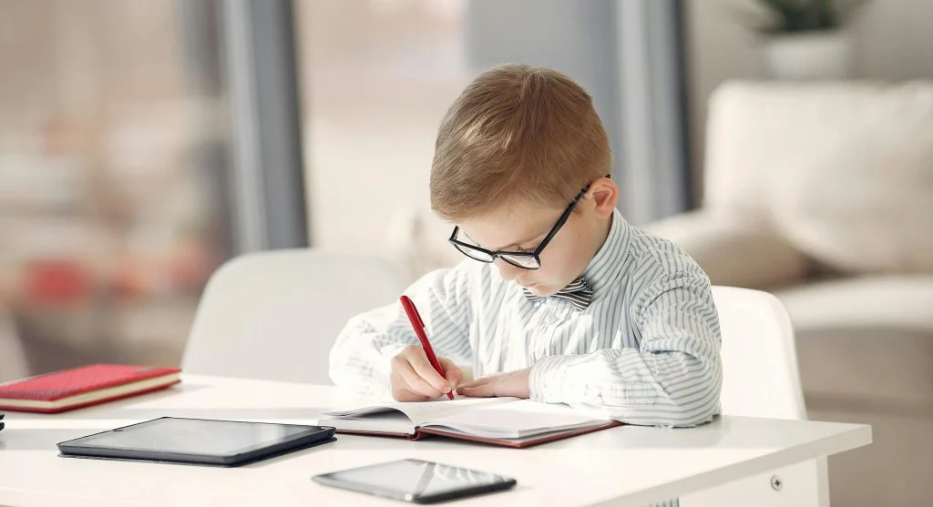 Child using visual homework checklists to begin work more easily