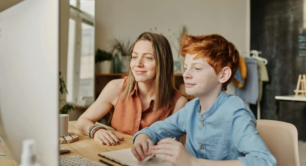 Parent and child using visual homework checklists to improve homework follow-through