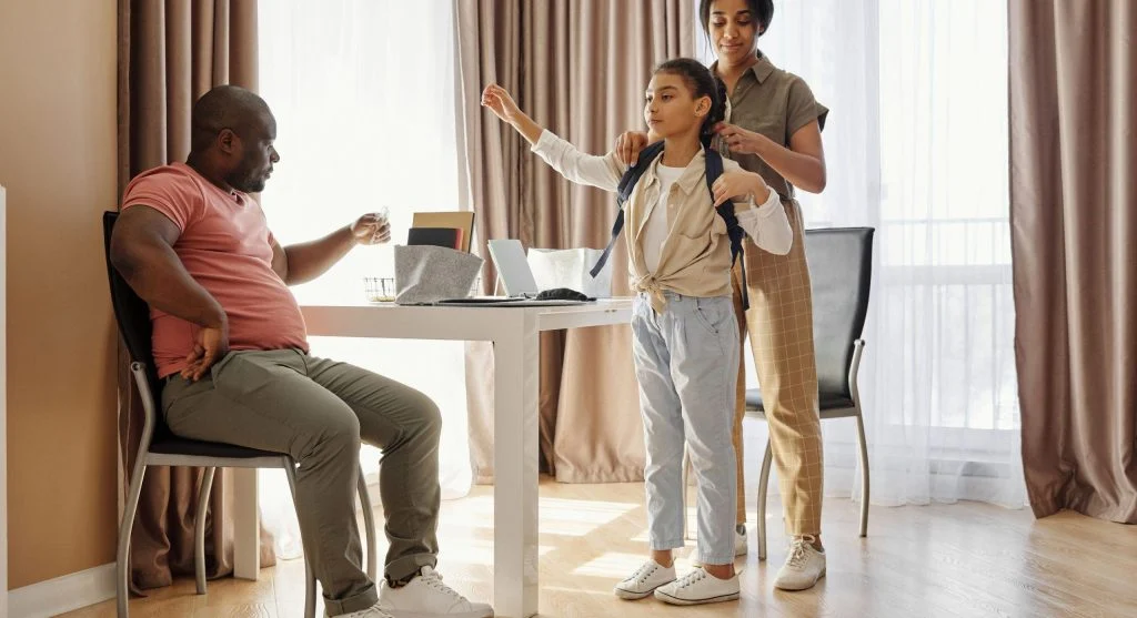 Parent and child checking after-school papers together in a calm routine