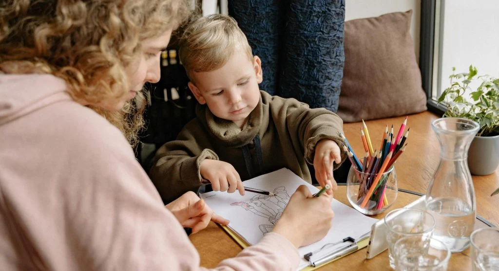 Parent and child organizing a simple homework space for better routines