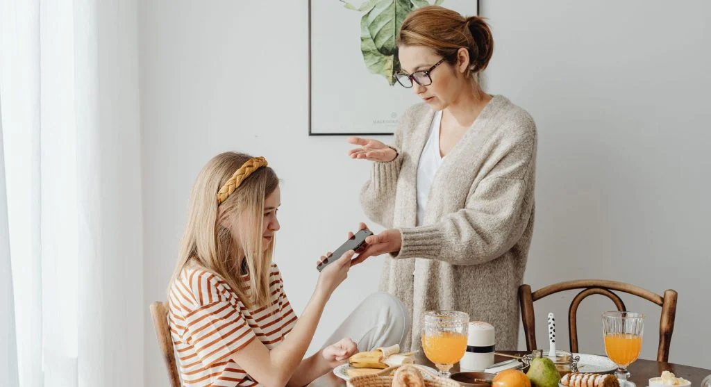 Parent setting a calm clear discipline limit during family life