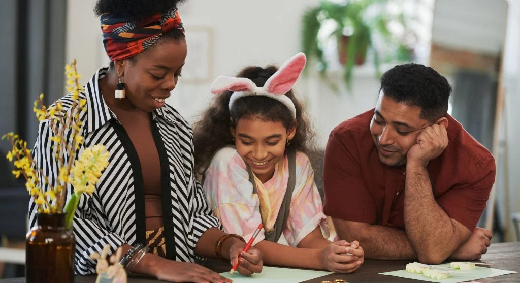 Parent and child completing the last step of a family school paper routine