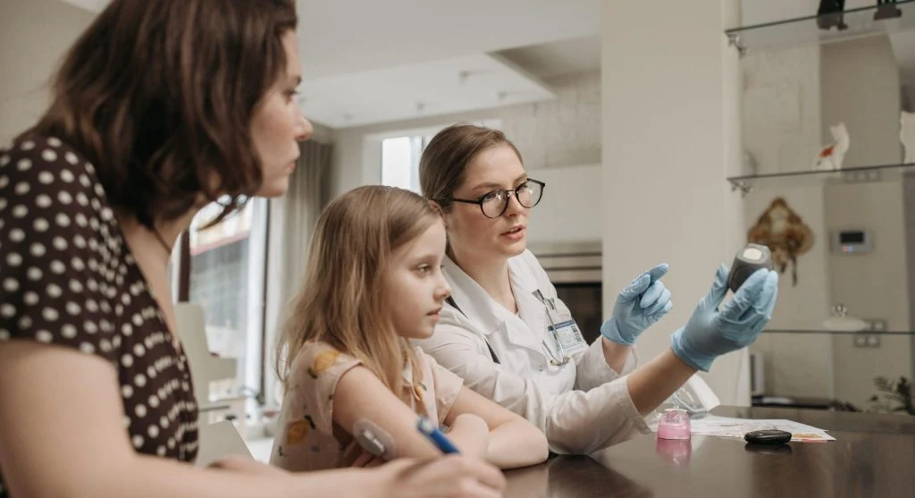 Parent giving patient support while child practices independence