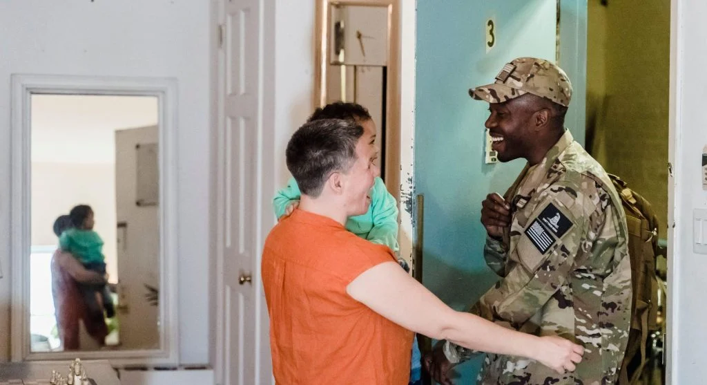 Parent welcoming a child home after a big school day
