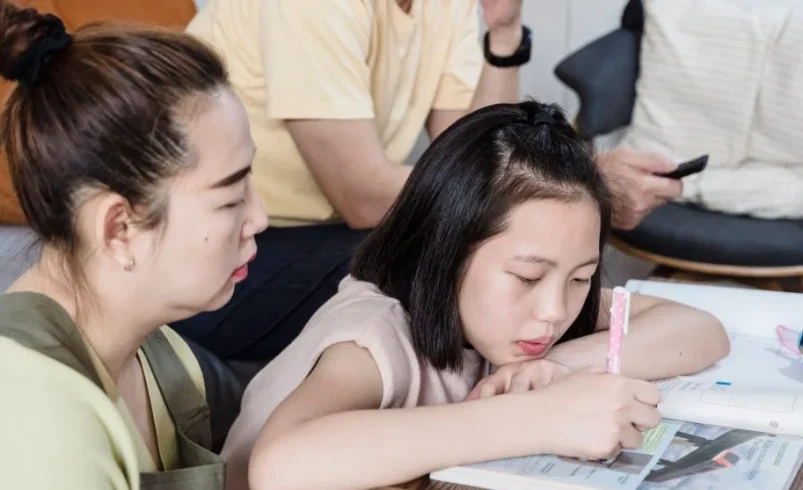 Parent helping a child prepare calmly for an important school day