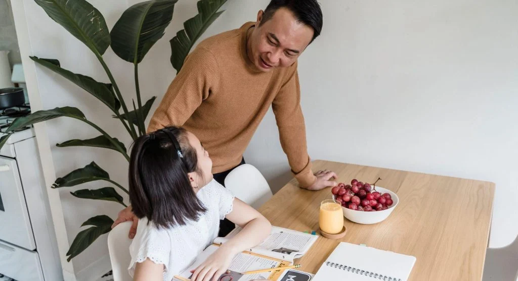 Parent helping child set healthy boundaries around personal belongings