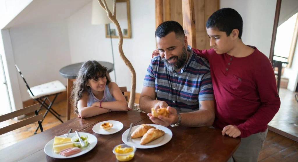 Family enjoying a calm breakfast during a slow weekend morning