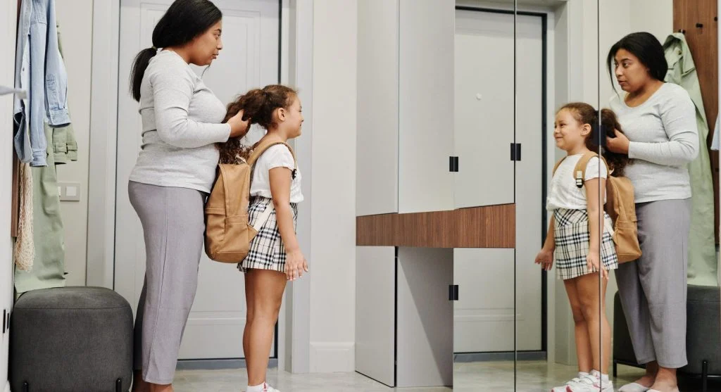 Parent and child checking school items during a simple evening reset