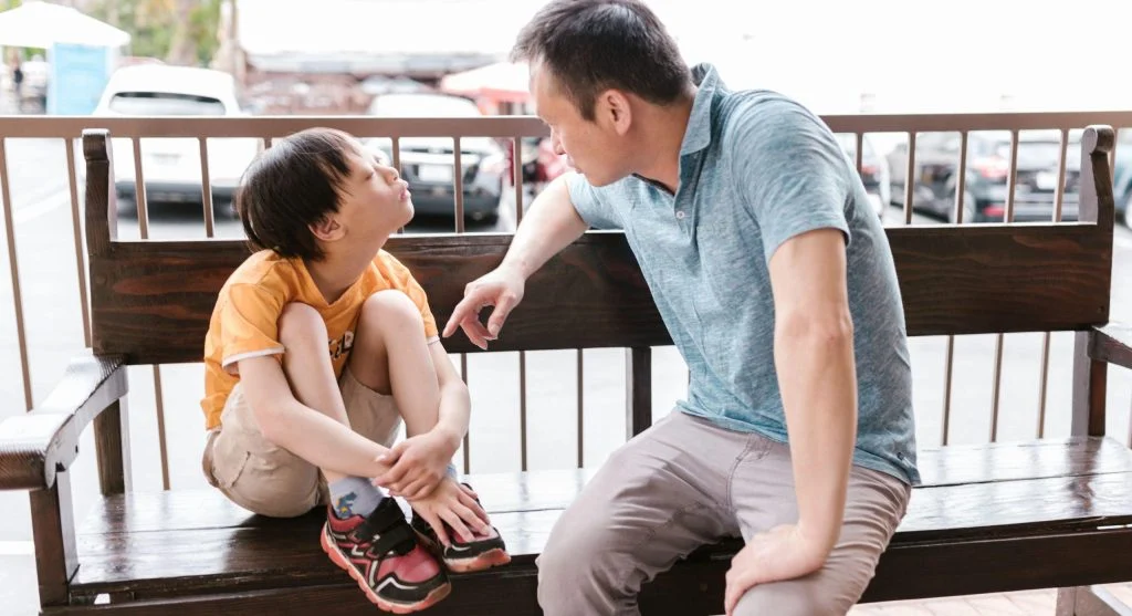Parent and child talking later after an earlier upset moment