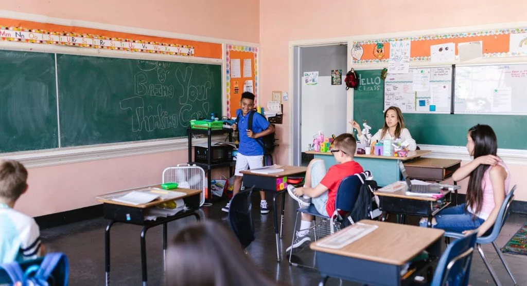 Classroom setting where children start comparing themselves to others during school years