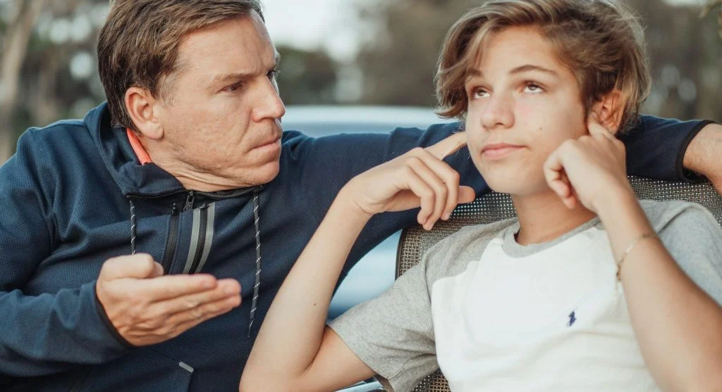 Parent giving space to a child who is upset but not ready to talk