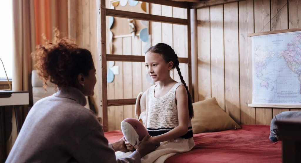 Quiet bedtime moment where a child opens up emotionally