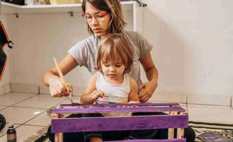 Parent and child taking part in a family fix-it hour