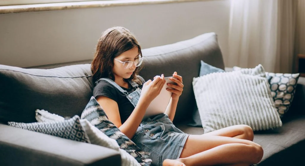 Child using quiet non-screen activities during a calm at-home routine