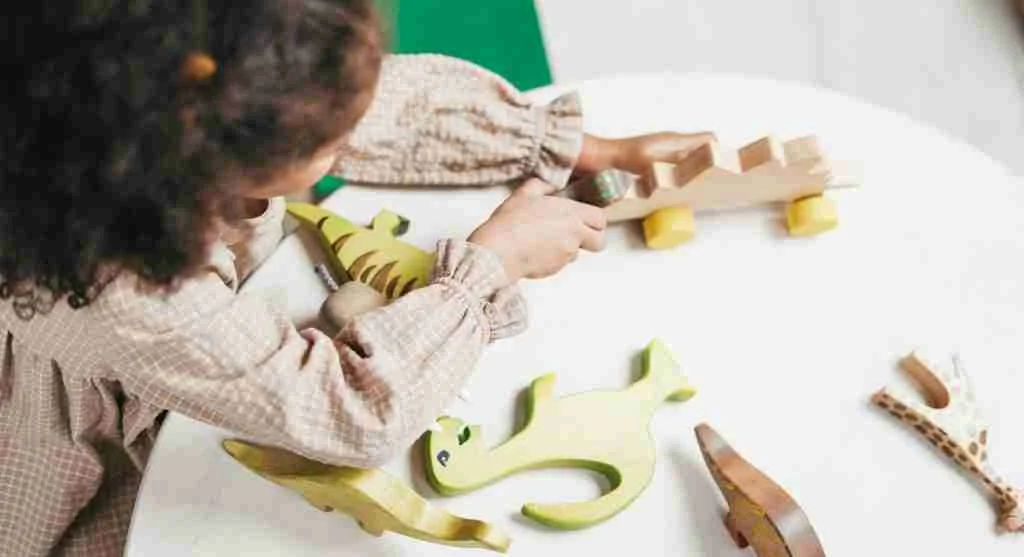 Child experiencing a quiet pause before beginning independent play