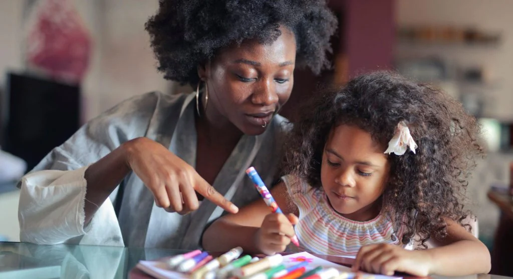 Parent and child reviewing school information together in a calm routine