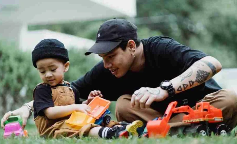 Parent giving focused attention to a child who wants an adult to watch