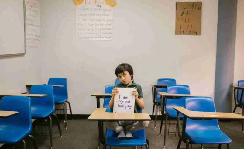Child using a handwritten note to communicate a difficult feeling