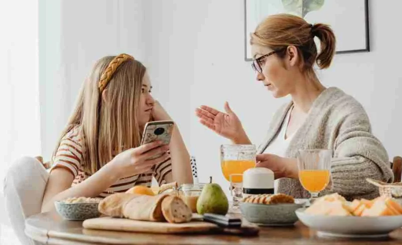 Parent giving a tween advance notice about a family schedule change