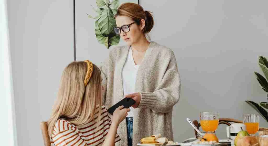 Parent calmly describing a repeated behavior problem to a child