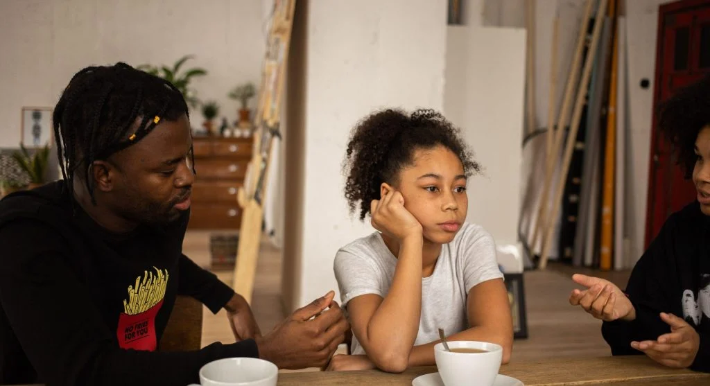 Child trying to explain a different perspective during a hard family conversation