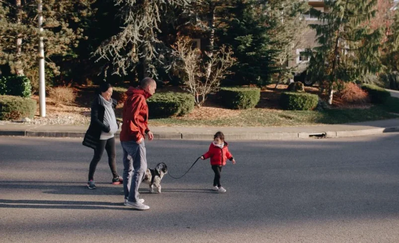 Family taking a small after-dinner walk together in the evening