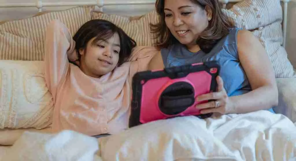 Parent and child calmly reviewing online content together before making a decision
