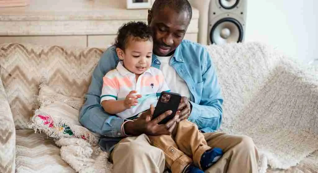 Parent teaching voice message safety for children