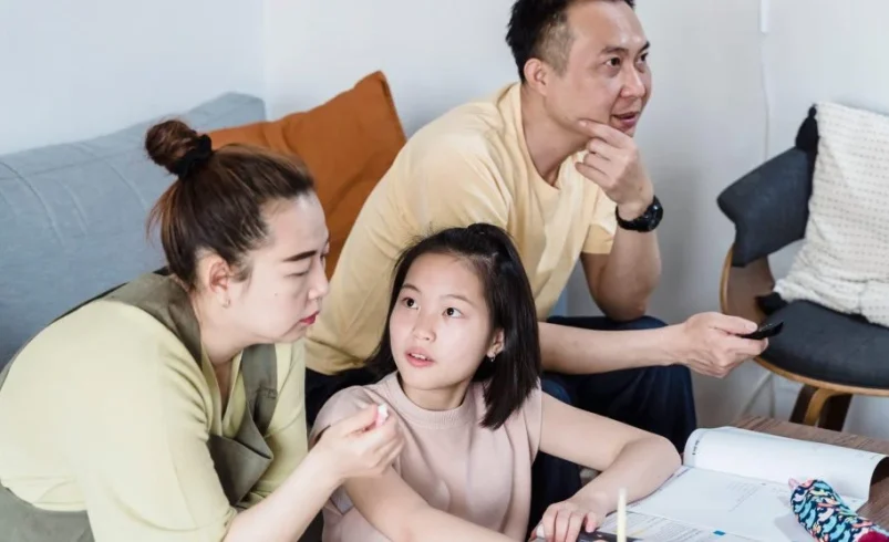 Parent listening carefully while a child explains a different version of what happened