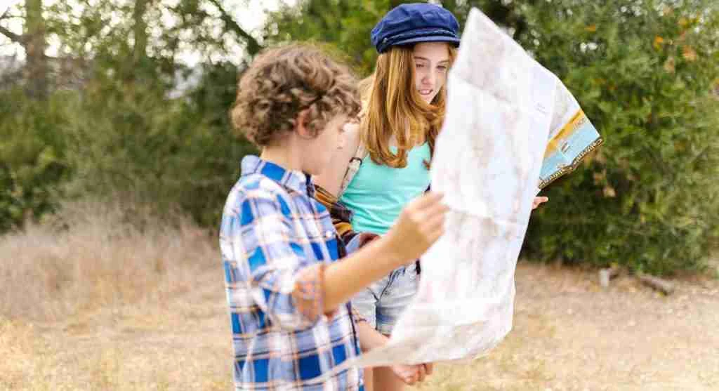 Child using a map to follow a familiar neighborhood route