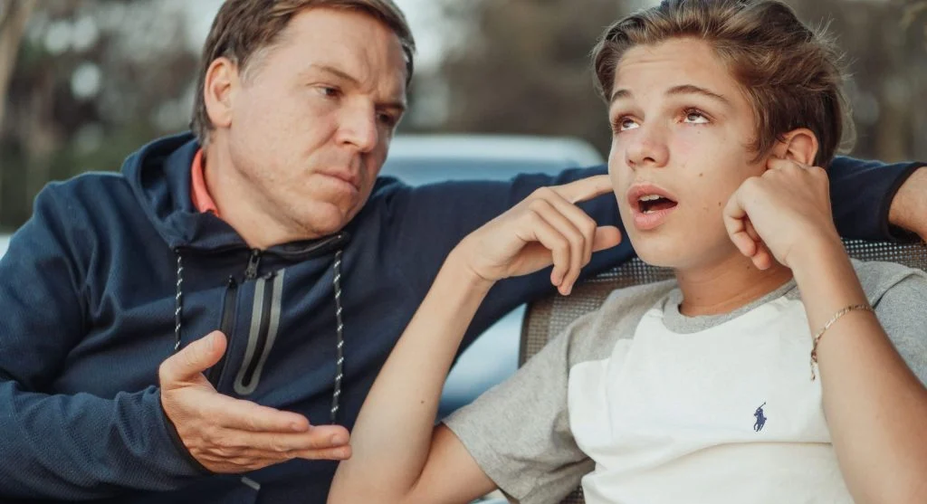 Child trying to explain a different perspective during a hard family conversation
